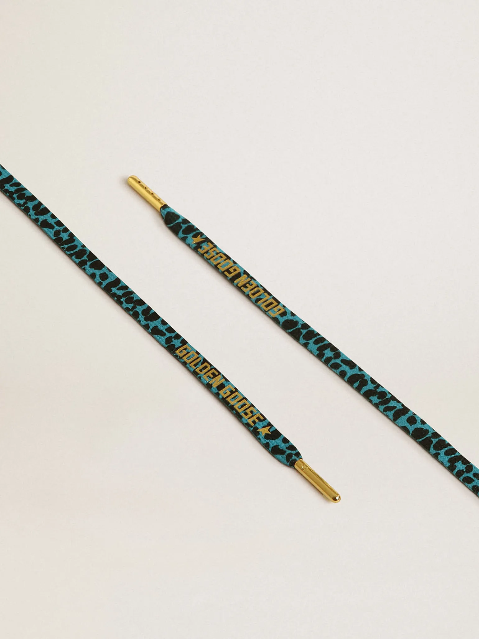 Online Cadarços salpicados em azul e preto com logo dourado em contraste MULHER Cadarços | Cadarços