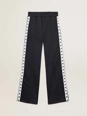 Online Calça de jogging azul-escura, fita branca e estrelas em contraste MULHER Jeans e calças